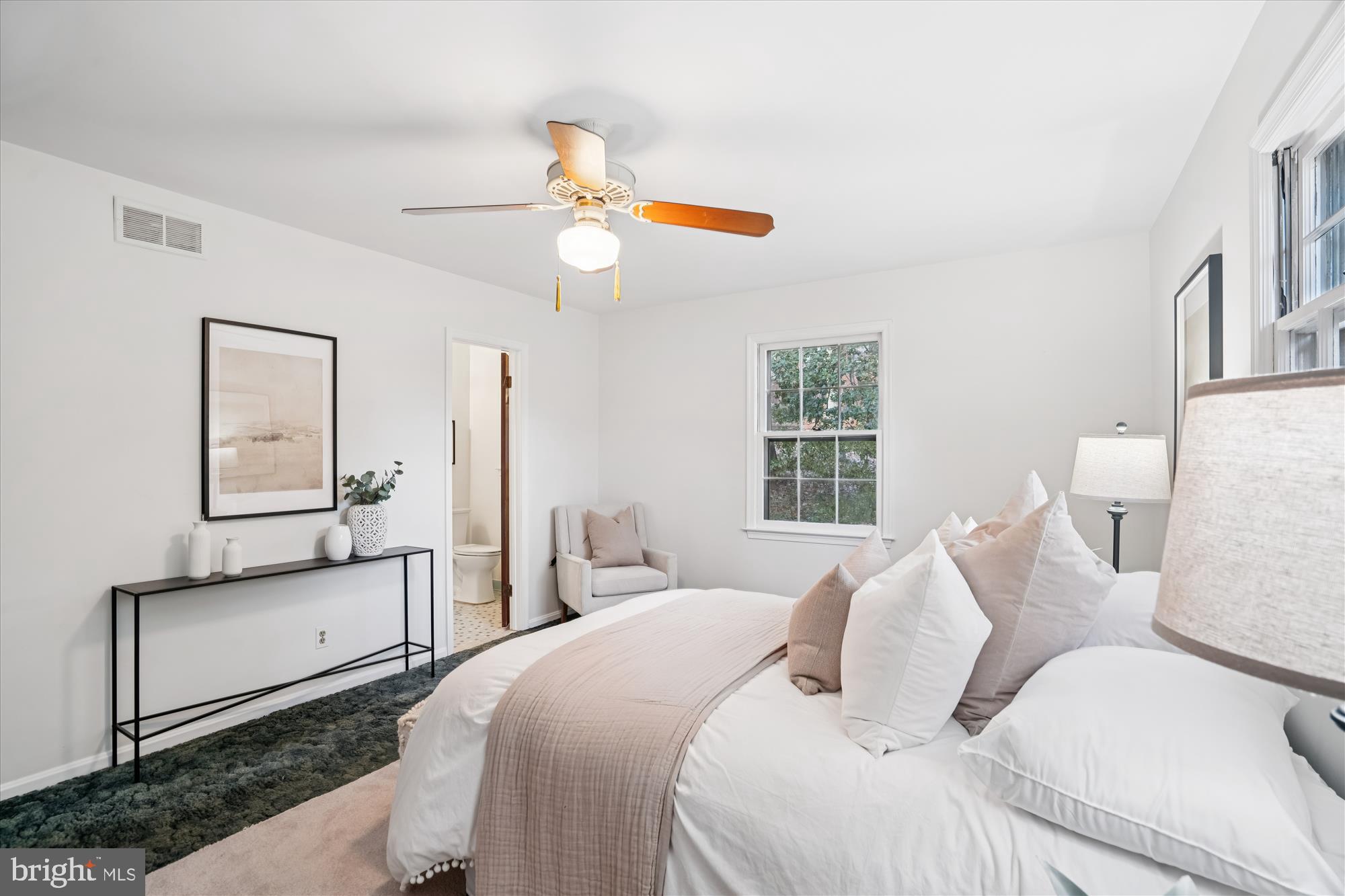 1912 Kimberly Road Silver Spring, MD 20903 - Photo 19 of 45 a bedroom with a bed and a chandelier