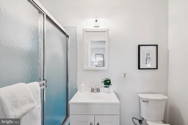 a bathroom with a sink toilet and vanity