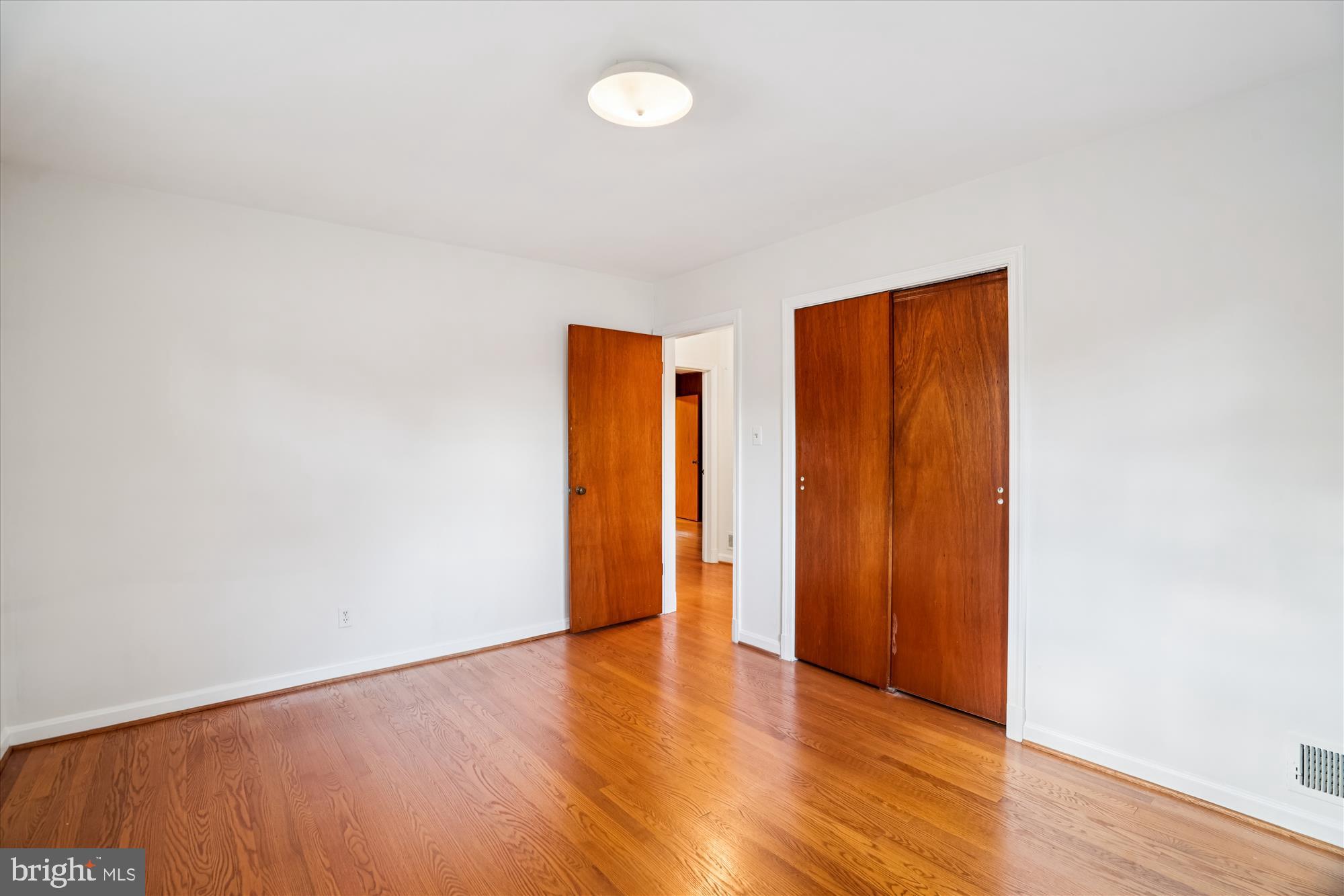 1912 Kimberly Road Silver Spring, MD 20903 - Photo 26 of 45 a view of an empty room with wooden floor and closet