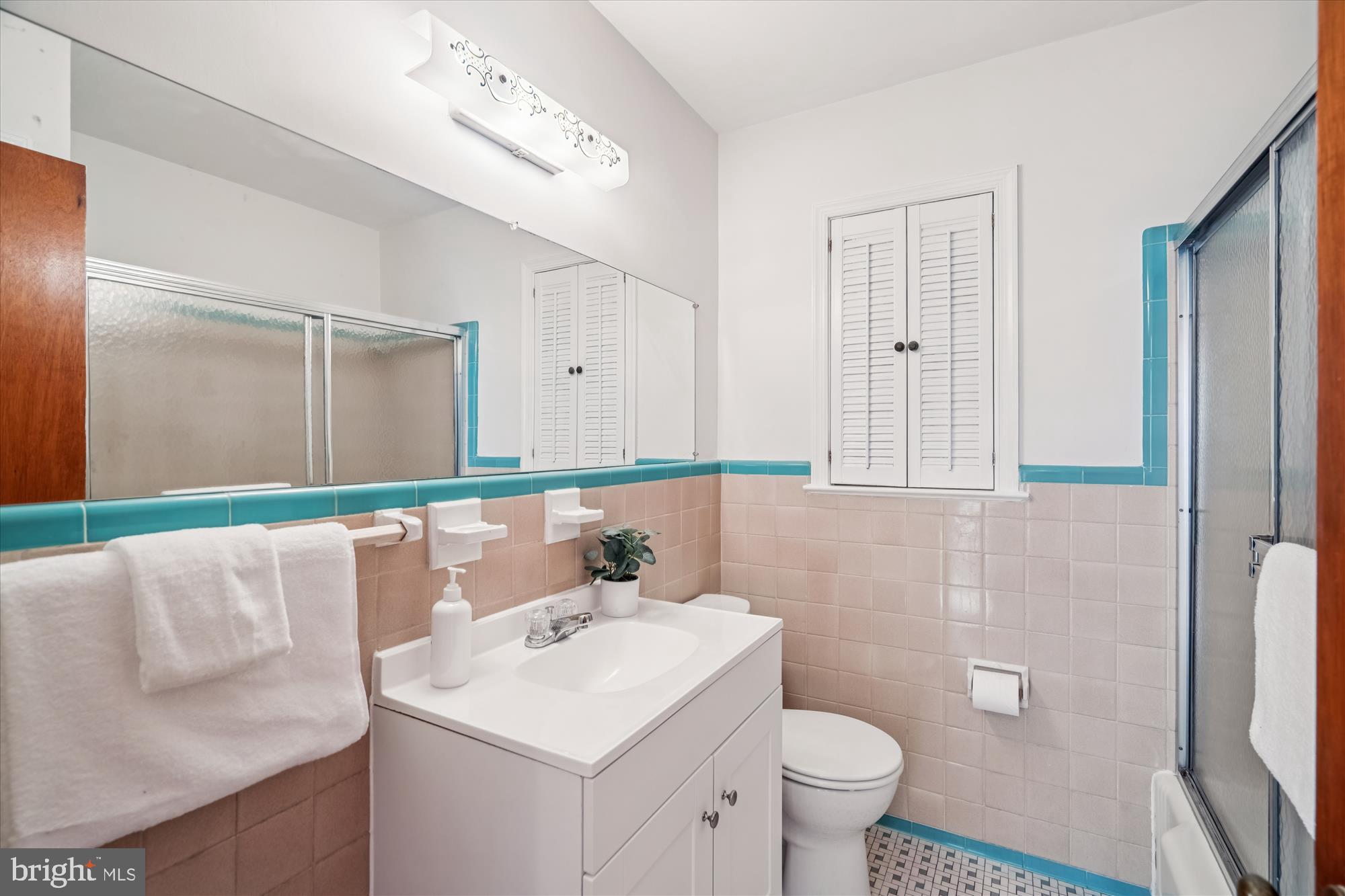 1912 Kimberly Road Silver Spring, MD 20903 - Photo 28 of 45 a bathroom with a sink a toilet and mirror