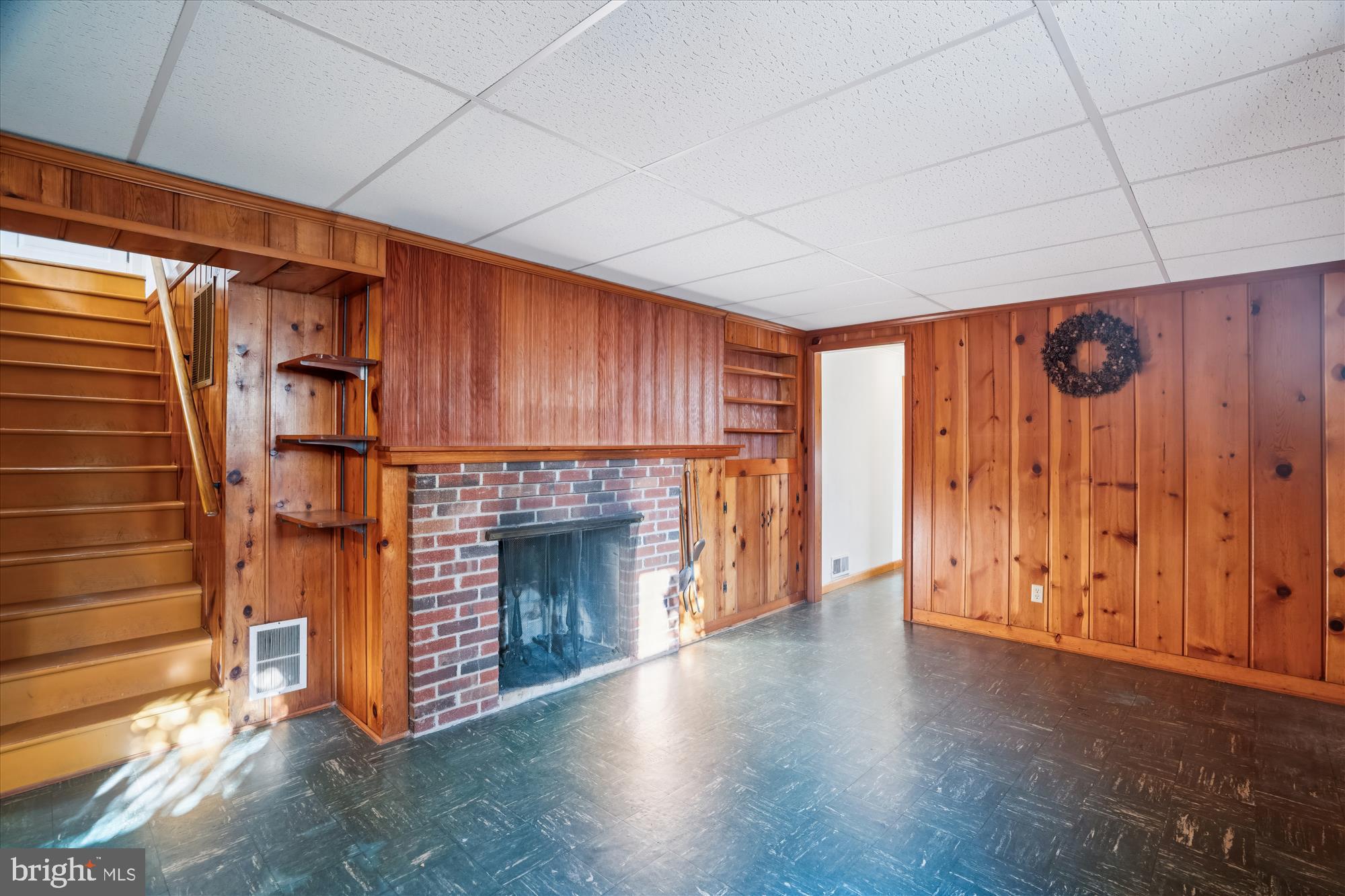 1912 Kimberly Road Silver Spring, MD 20903 - Photo 31 of 45 a view of an empty room with wooden floor fireplace and a window
