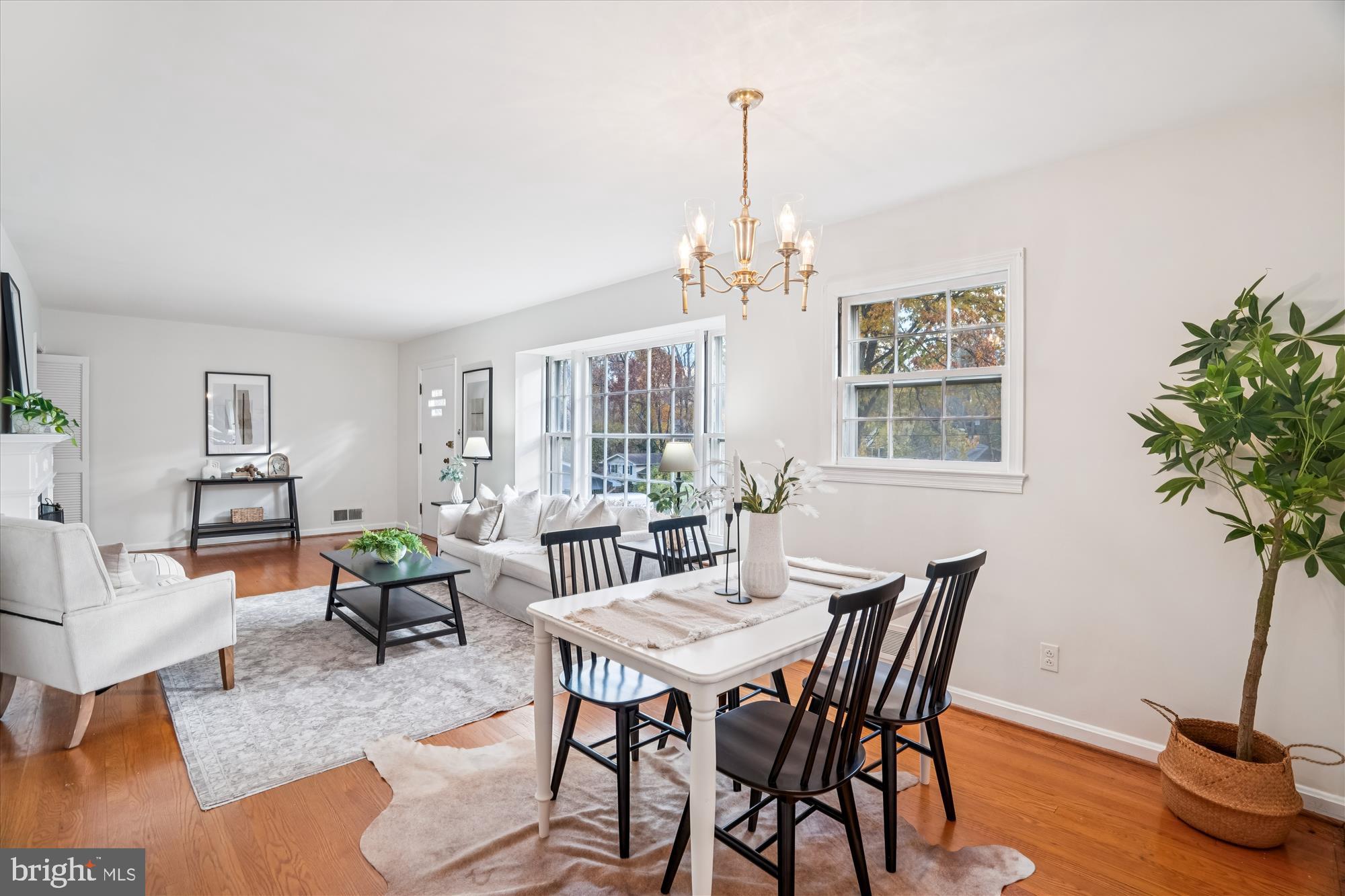 1912 Kimberly Road Silver Spring, MD 20903 - Photo 8 of 45 a view of a livingroom and dining room with furniture wooden floor a chandelier