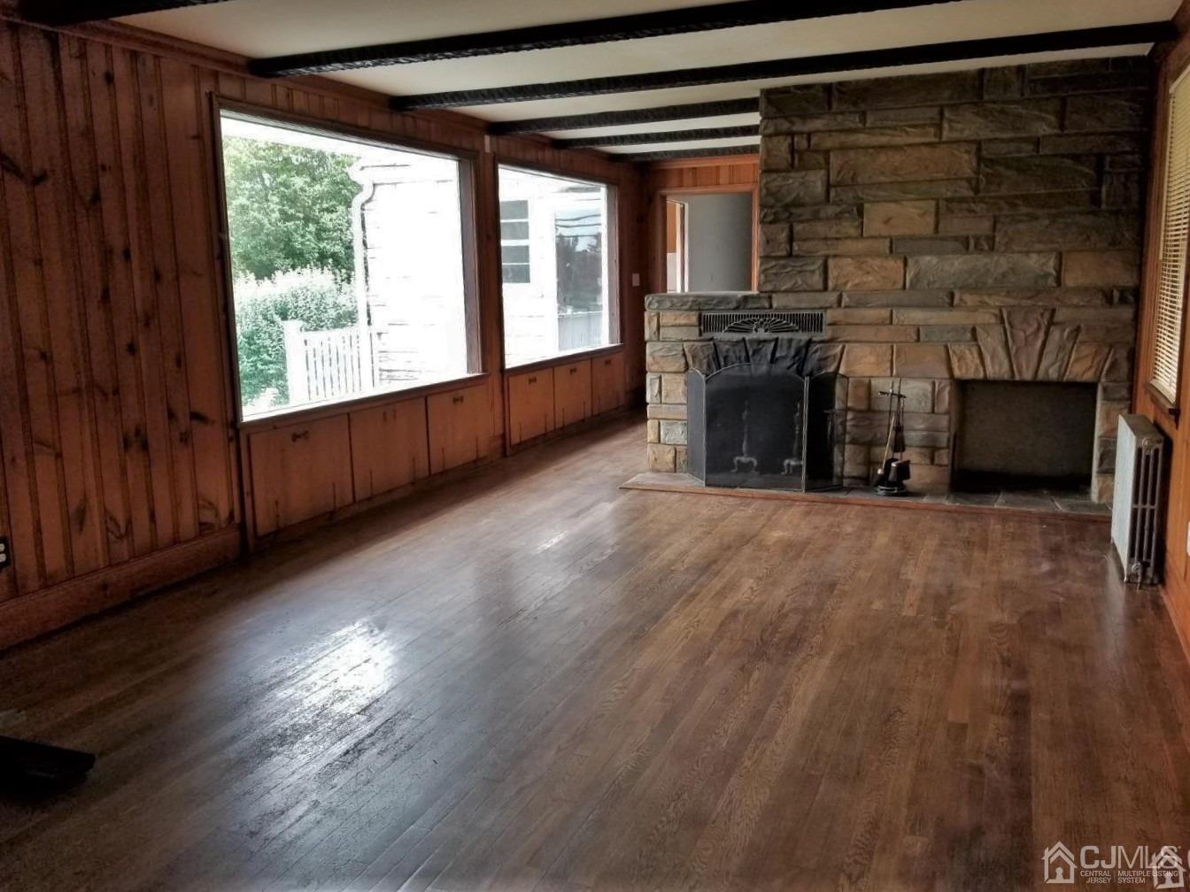 672 Hermann Road North Brunswick, NJ 08902 - Photo 9 of 15 a view of a room with wooden floor and a fireplace