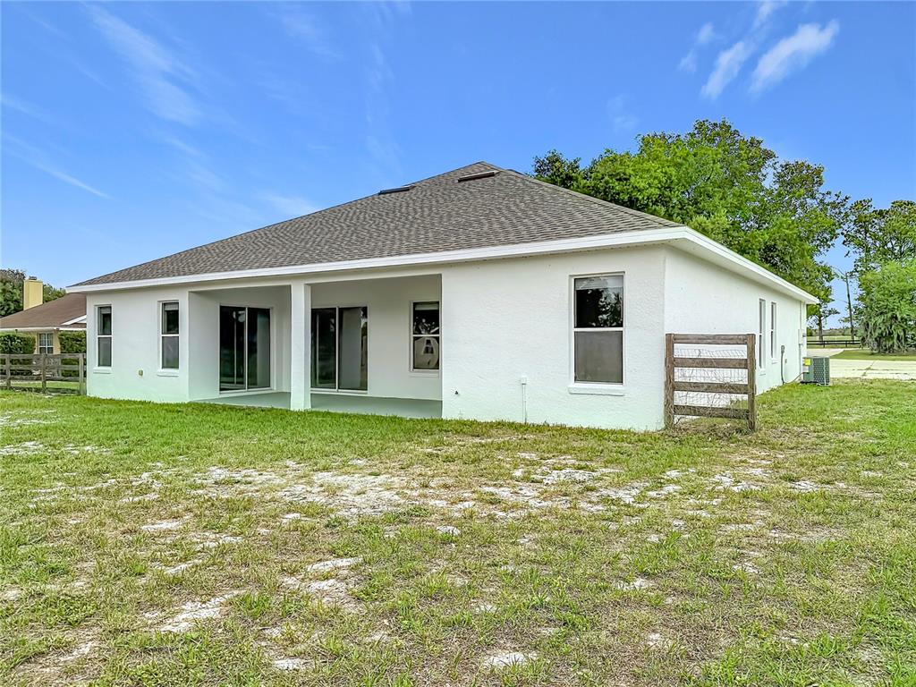 28549 Shirley Shores Road Tavares, FL 32778 - Photo 56 of 65 a view of a house with a yard