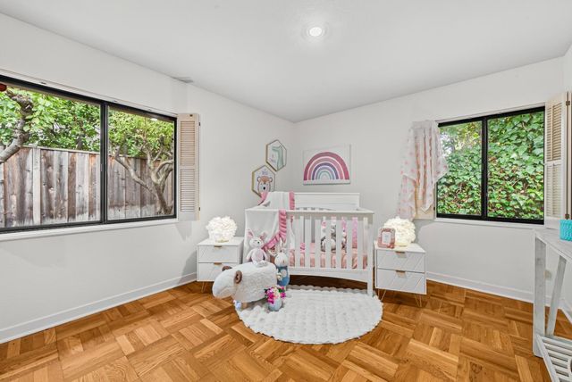 a bed room with furniture and a window