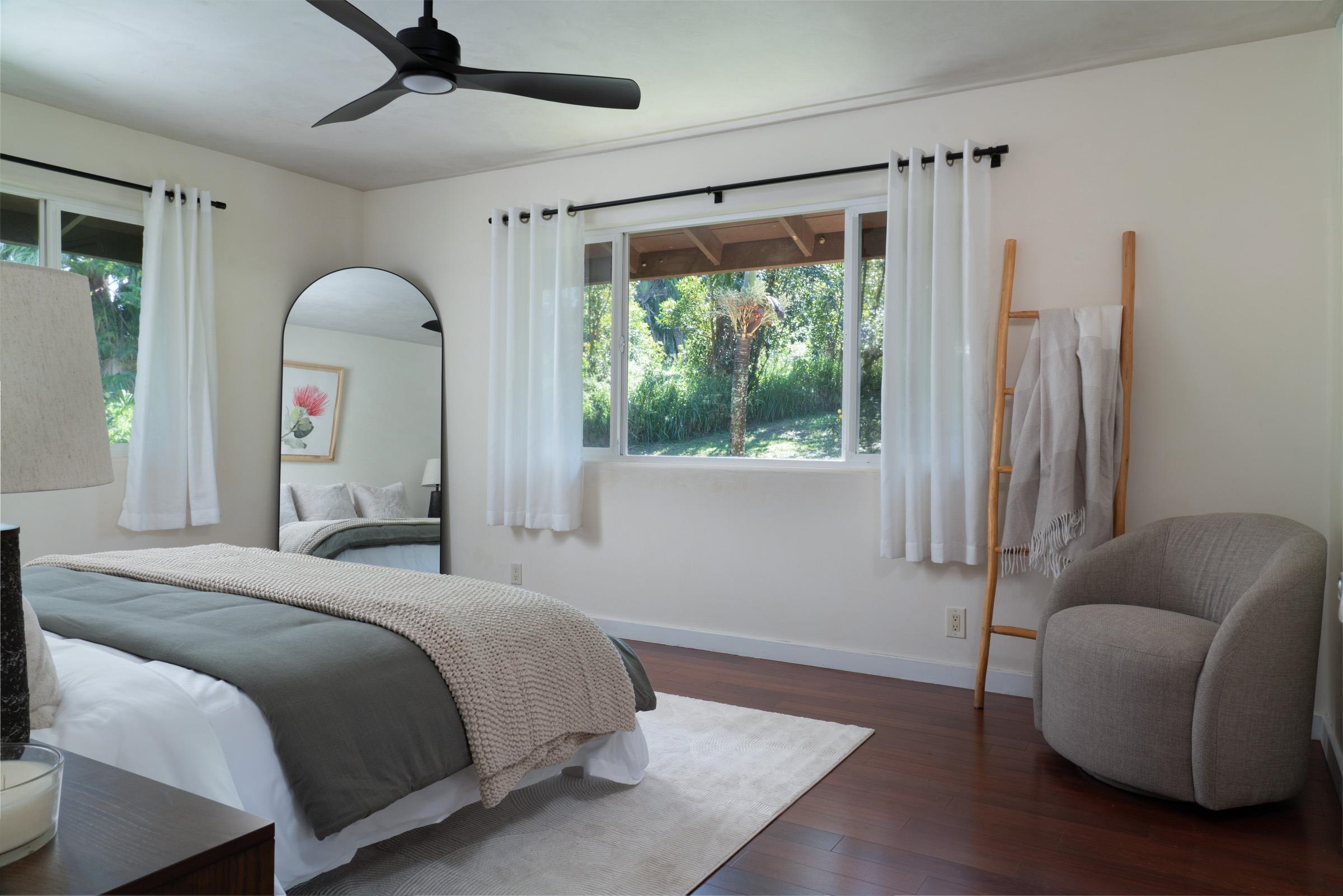 4509 Opana Place Haiku, HI 96708 - Photo 12 of 31 a bedroom with furniture and a large window