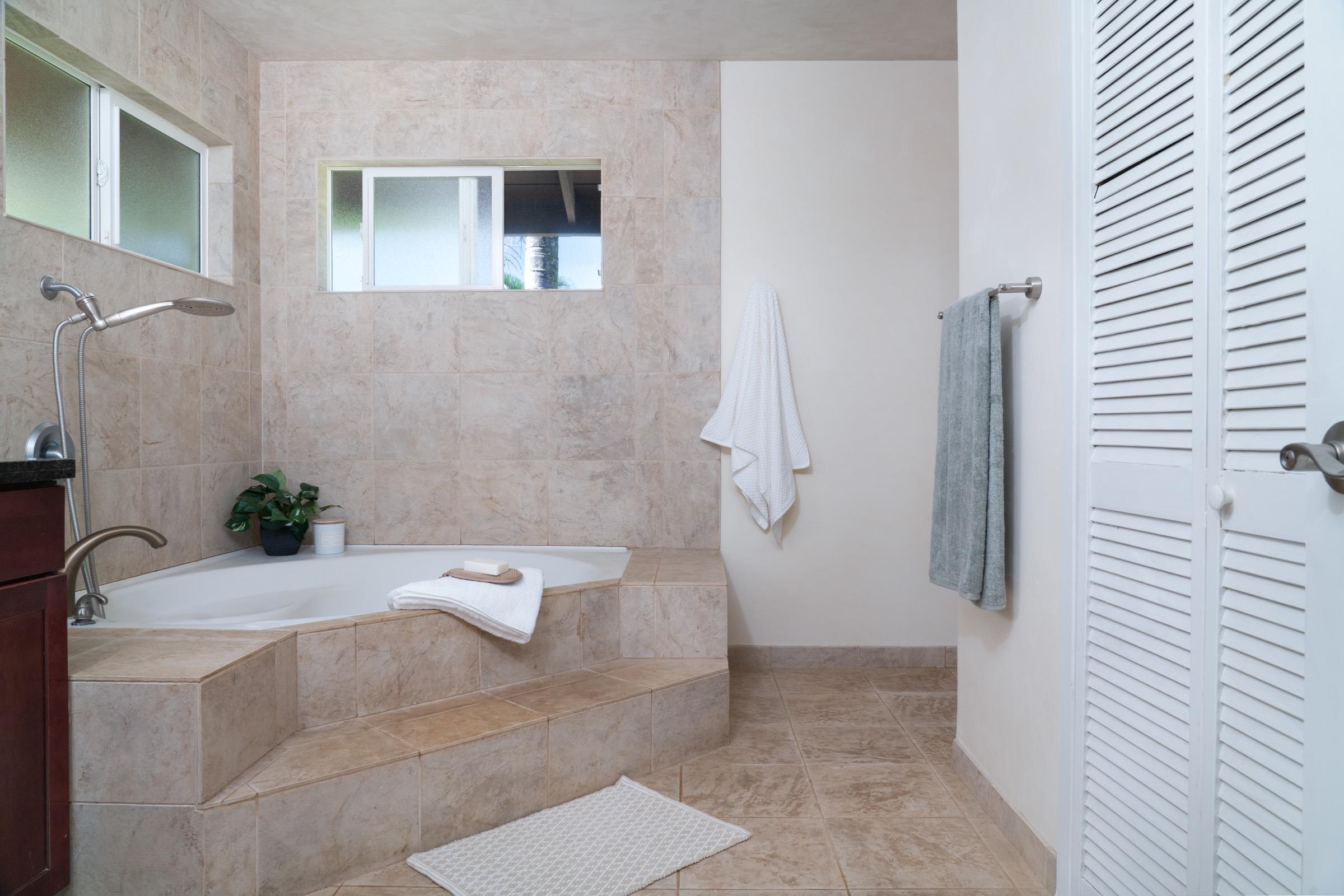 4509 Opana Place Haiku, HI 96708 - Photo 14 of 31 a bathroom with a bathtub and a shower