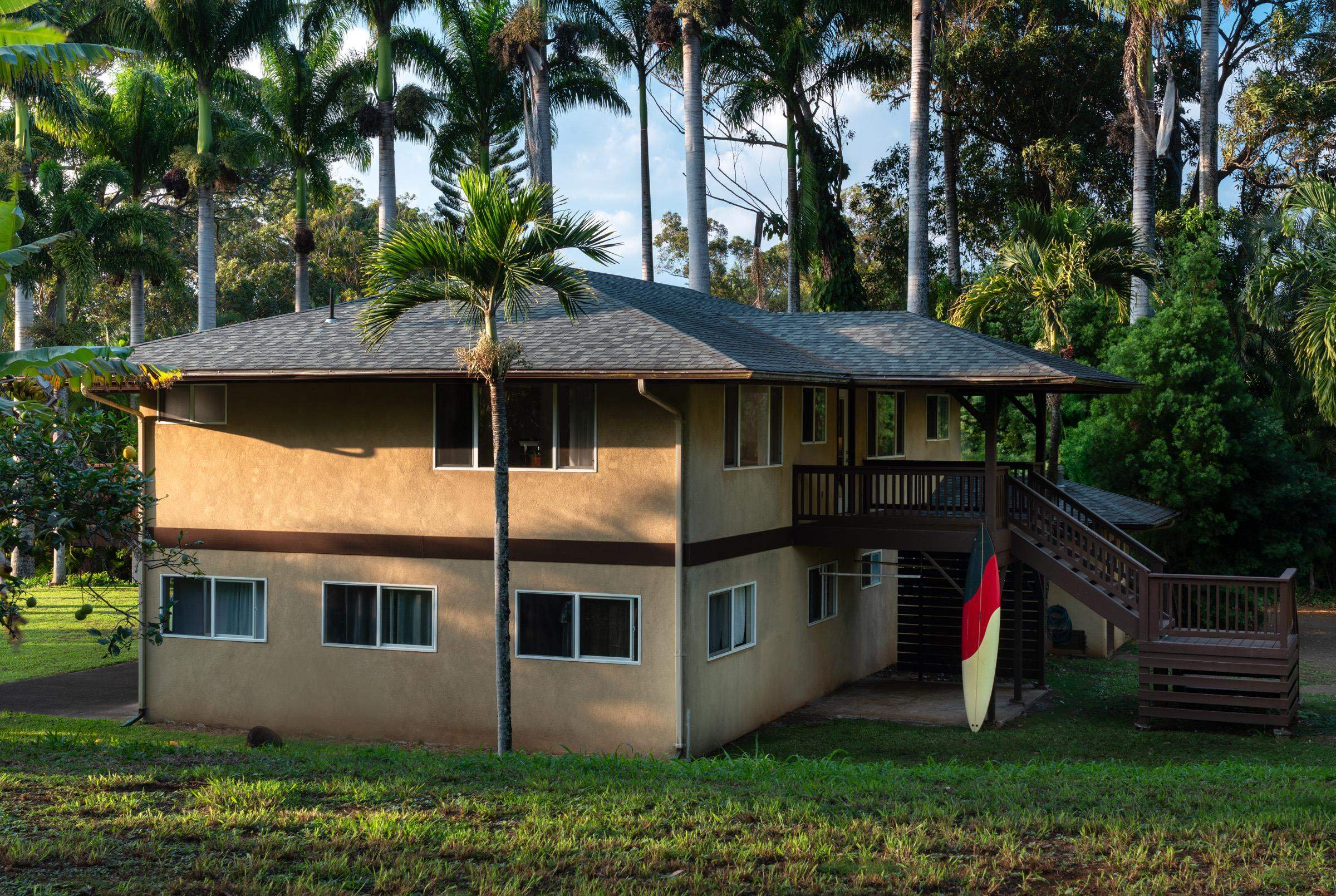 4509 Opana Place Haiku, HI 96708 - Photo 23 of 31 a front view of house with yard and green space
