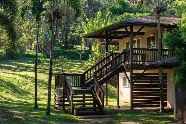 a view of a wooden deck with a yard