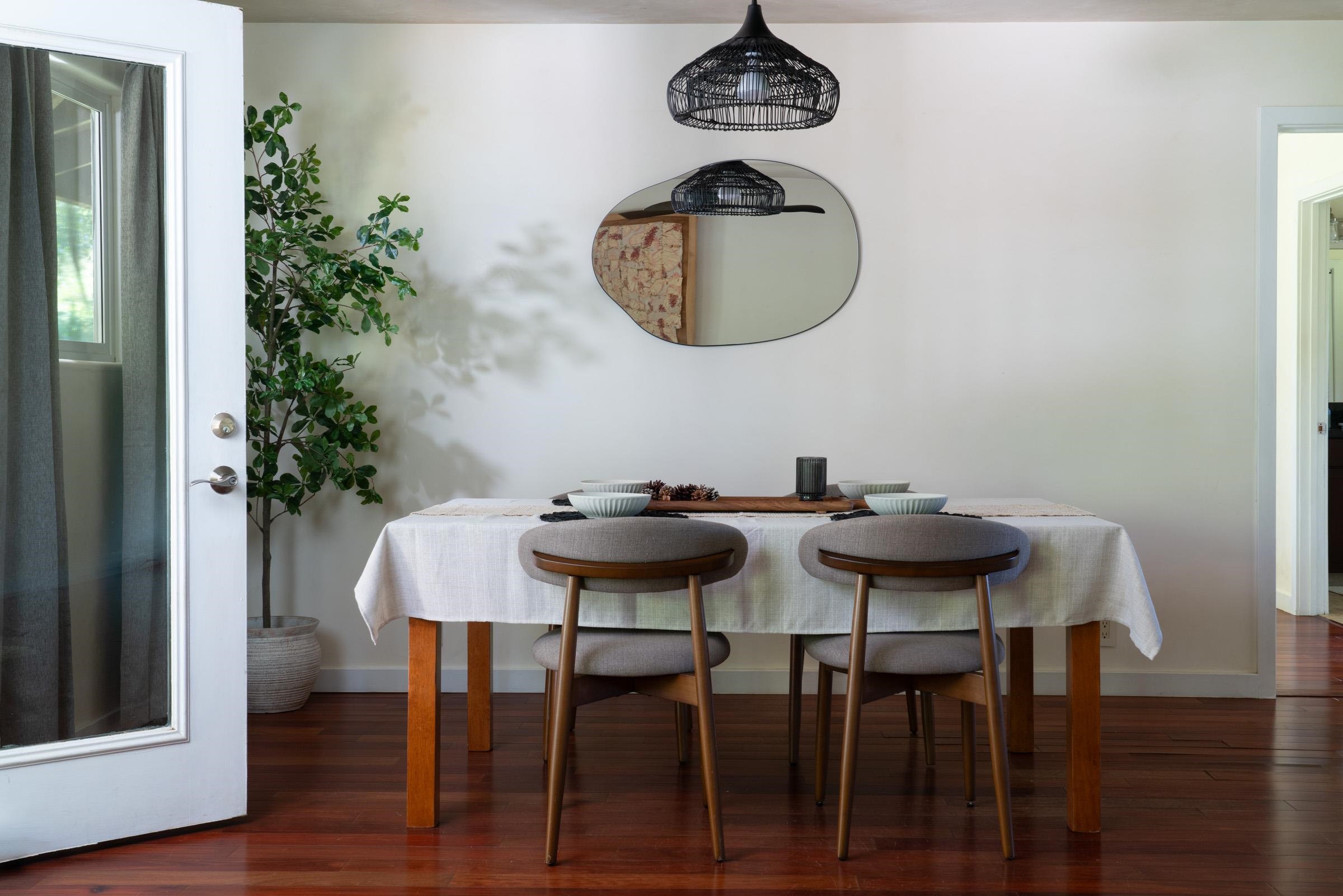 4509 Opana Place Haiku, HI 96708 - Photo 8 of 31 a view of a dining room with furniture and wooden floor