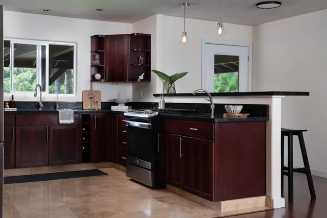 a kitchen with a sink and wooden cabinets