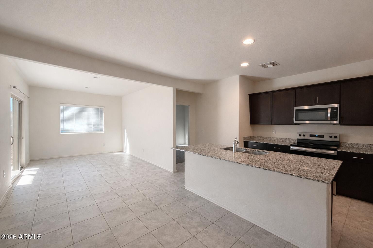 5032 South 251st Drive Buckeye, AZ 85326 - Photo 2 of 17 34C46390-C116-4B22-A6AC-9935DC1089CE