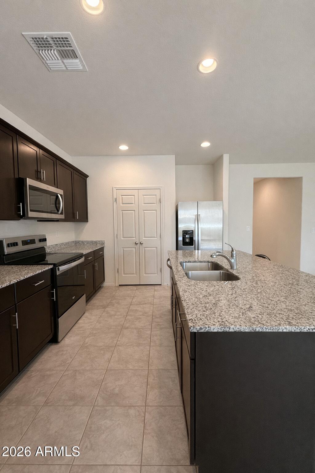 5032 South 251st Drive Buckeye, AZ 85326 - Photo 3 of 17 09FFBB98-7237-4176-9C08-E129168366B9