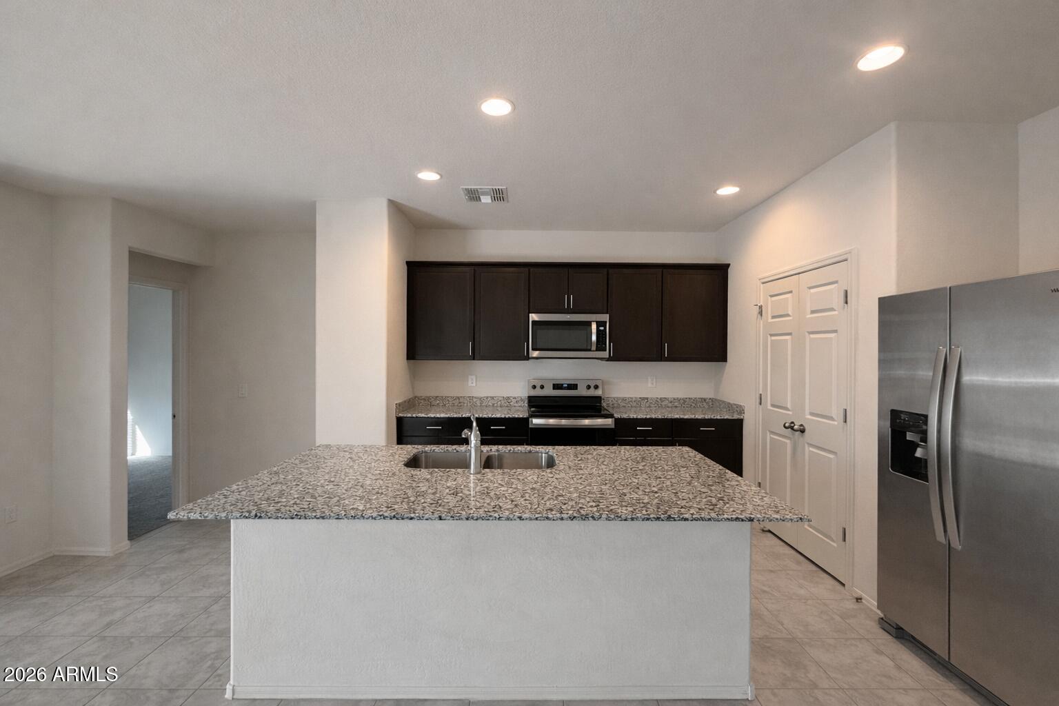 5032 South 251st Drive Buckeye, AZ 85326 - Photo 4 of 17 9D6CFCA0-32C7-42B2-884B-13750AB9ECEA