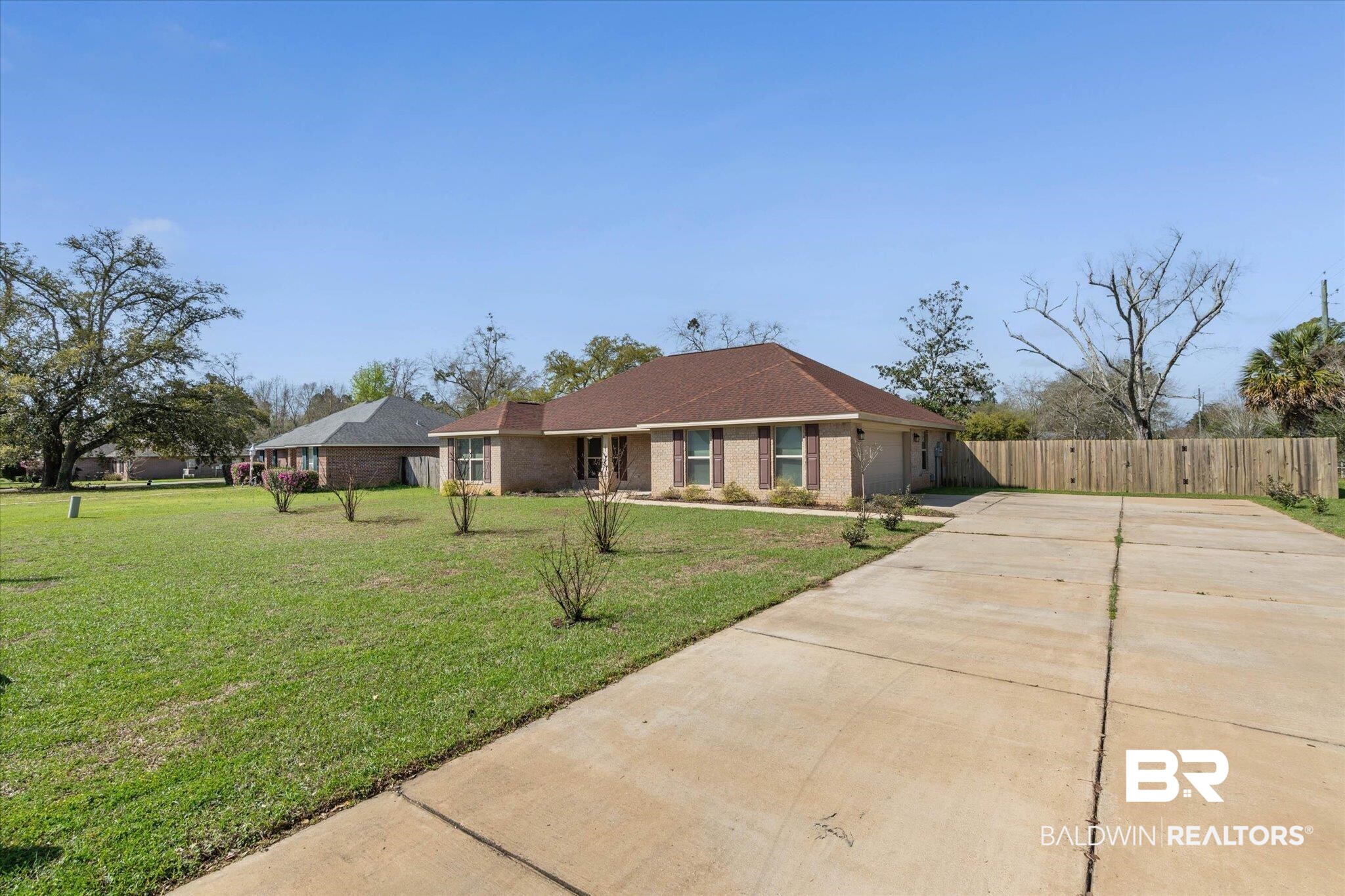 101 Washington Boulevard Foley, AL 36535 - Photo 29 of 32 Ranch-style house featuring driveway, brick siding, and a garage