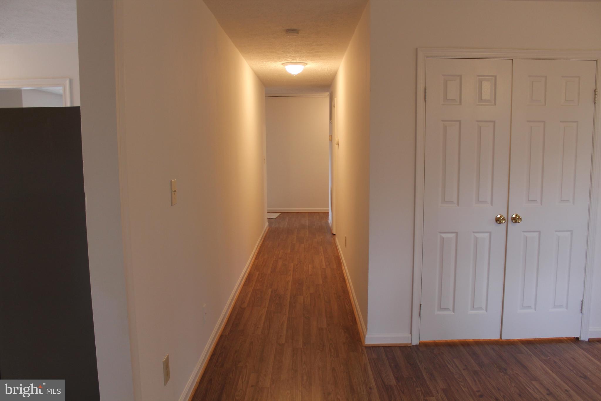 44 Hickory Tree Road Front Royal, VA 22630 - Photo 14 of 30 a view of a hallway with wooden floor