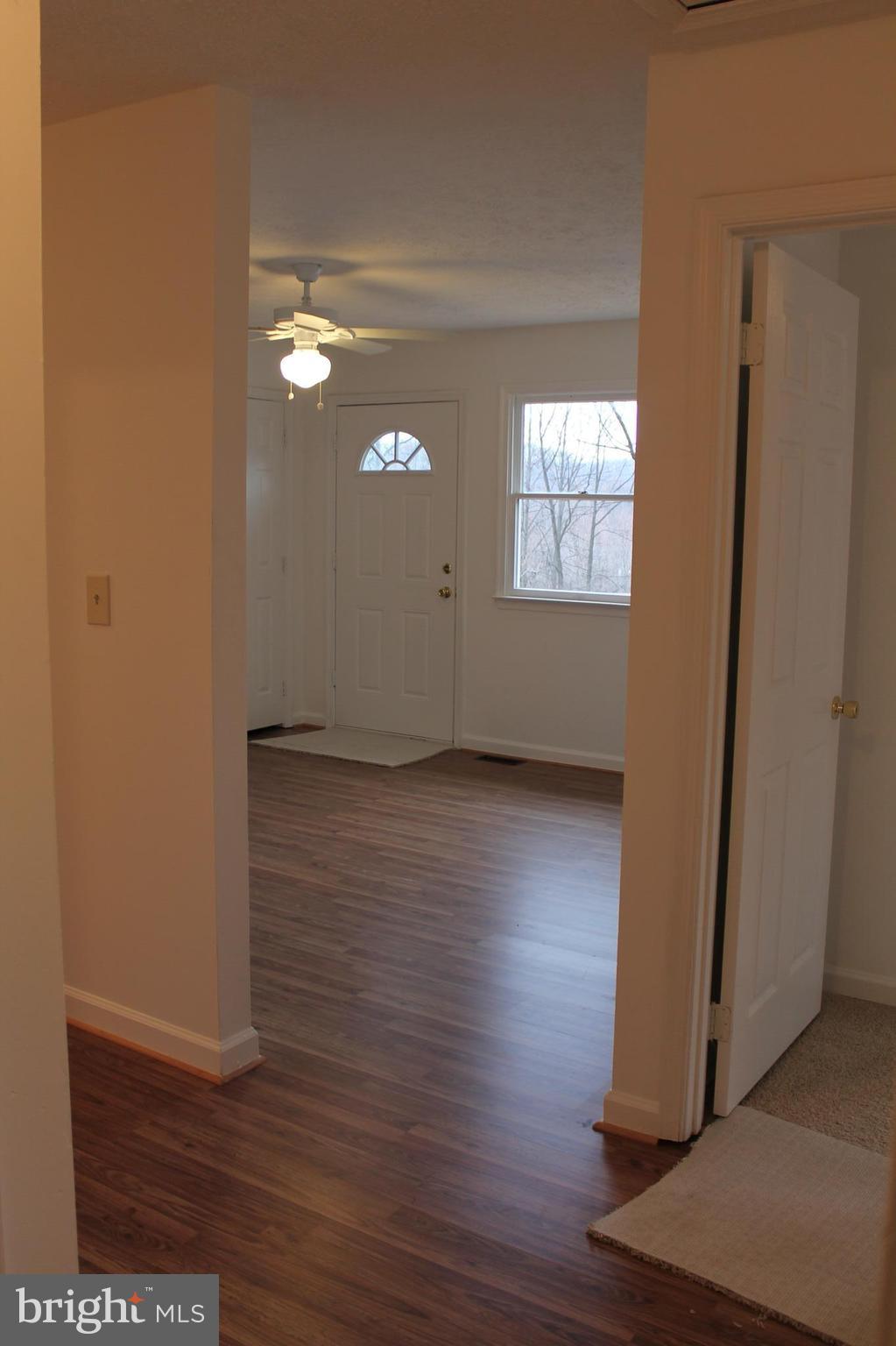 44 Hickory Tree Road Front Royal, VA 22630 - Photo 16 of 30 an empty room with wooden floor and windows