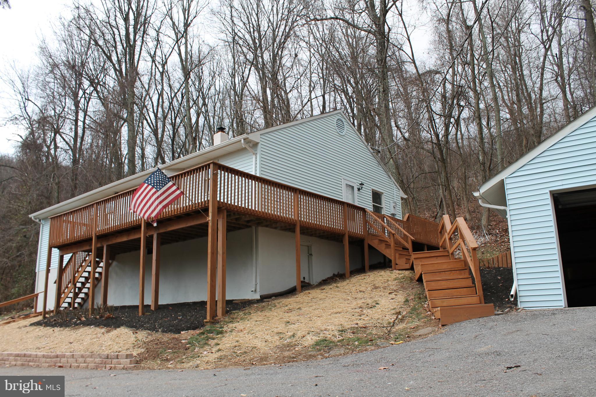 44 Hickory Tree Road Front Royal, VA 22630 - Photo 27 of 30 a house with trees in front of it
