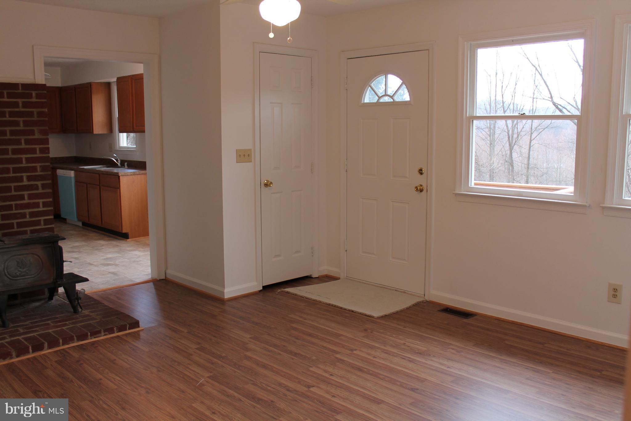 44 Hickory Tree Road Front Royal, VA 22630 - Photo 4 of 30 a view of empty room with wooden floor and fan