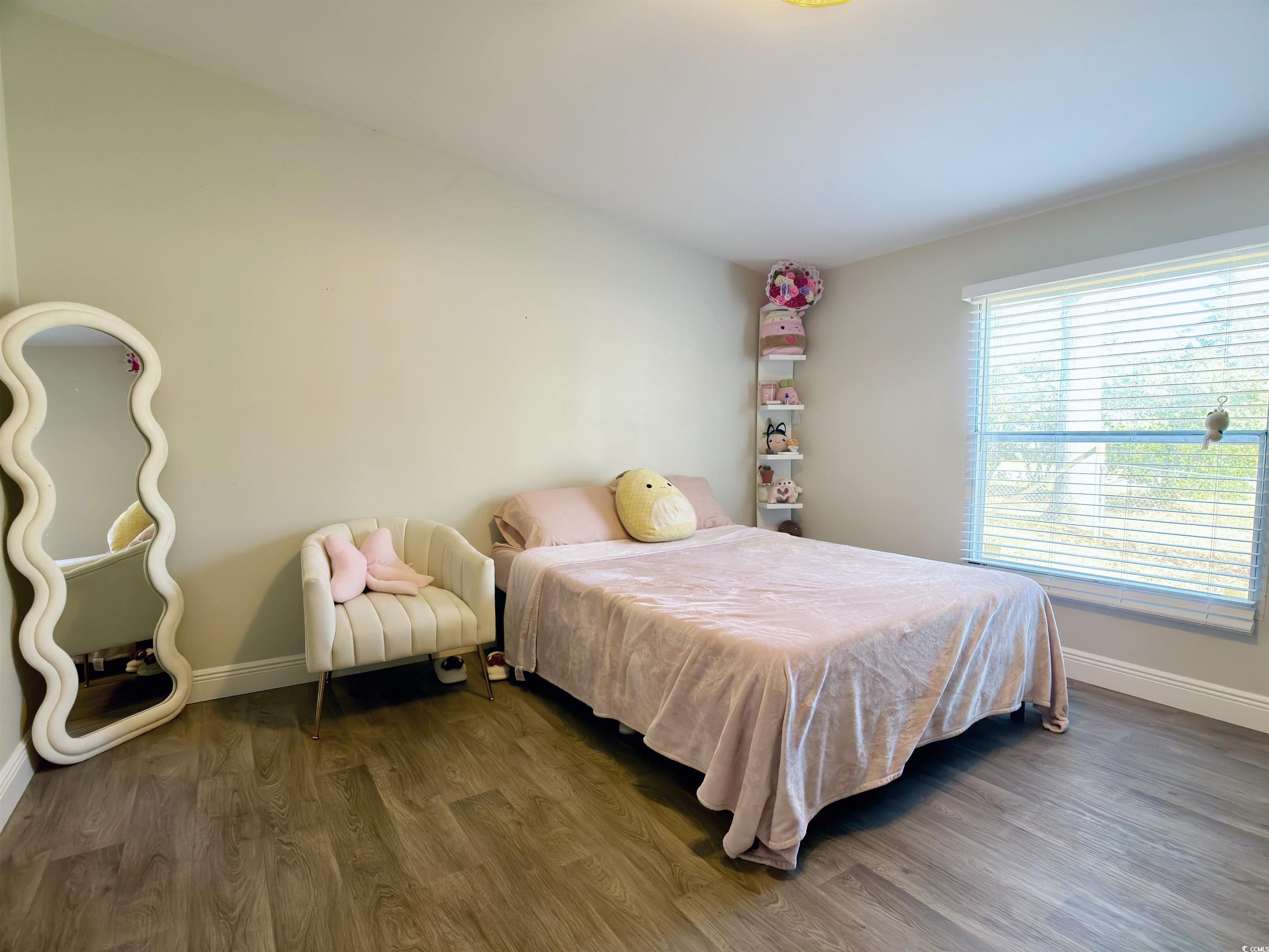 119 Ranchette Circle Myrtle Beach, SC 29588 - Photo 11 of 27 Bedroom with wood finished floors and baseboards