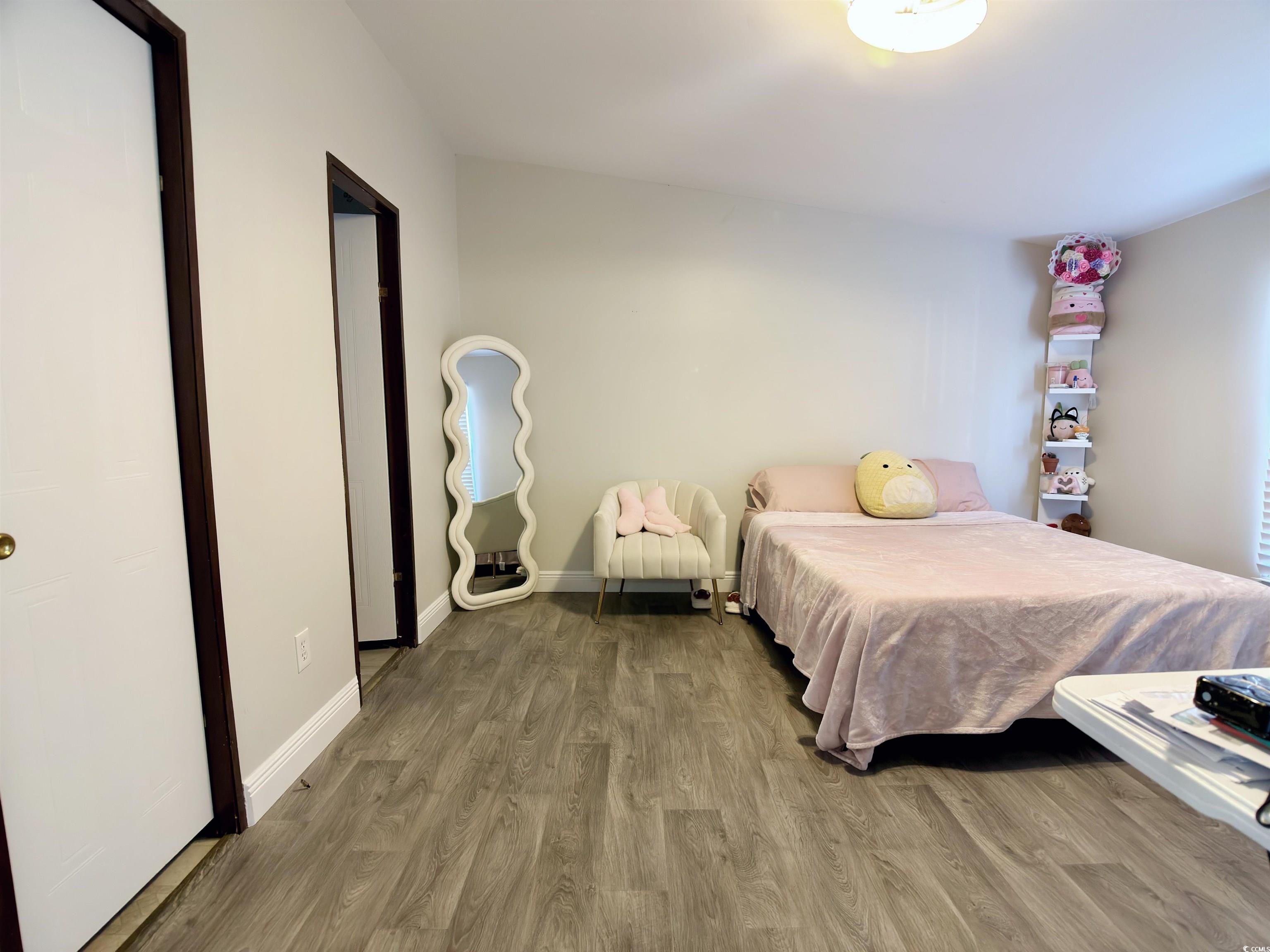 119 Ranchette Circle Myrtle Beach, SC 29588 - Photo 12 of 27 Bedroom featuring light wood-style floors and baseboards