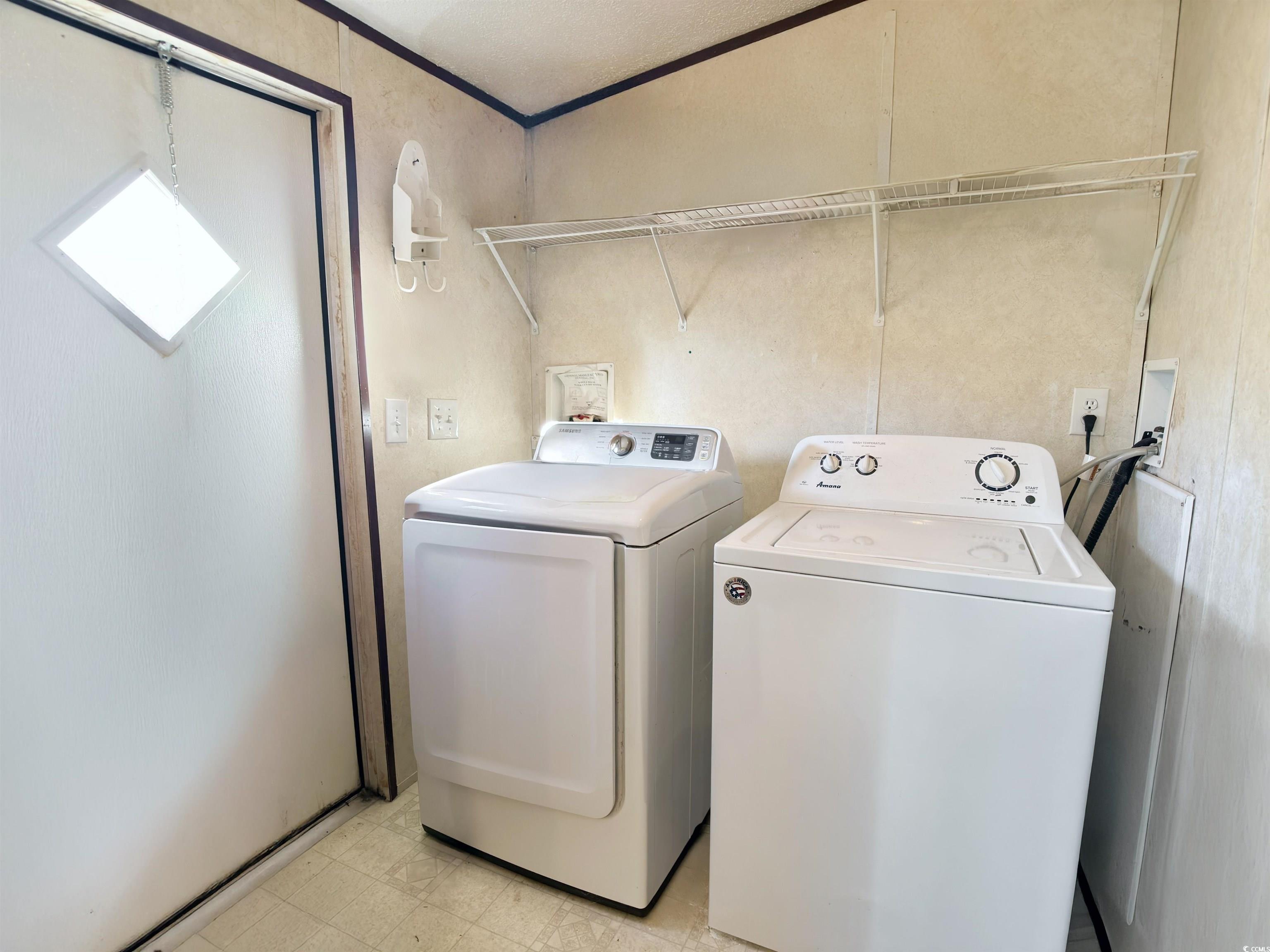 119 Ranchette Circle Myrtle Beach, SC 29588 - Photo 16 of 27 Laundry area with light flooring, separate washer and dryer, and crown molding