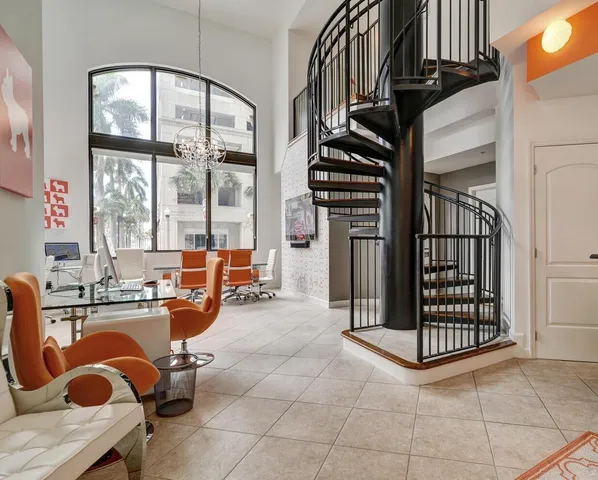a view of a livingroom with furniture and staircase