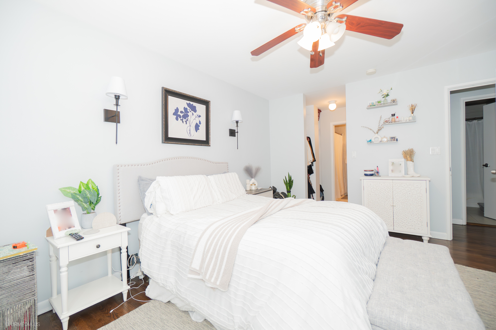 2201 North Cleveland Avenue, Unit 306 Chicago, IL 60614 - Photo 18 of 22 a spacious bedroom with a bed and a chandelier