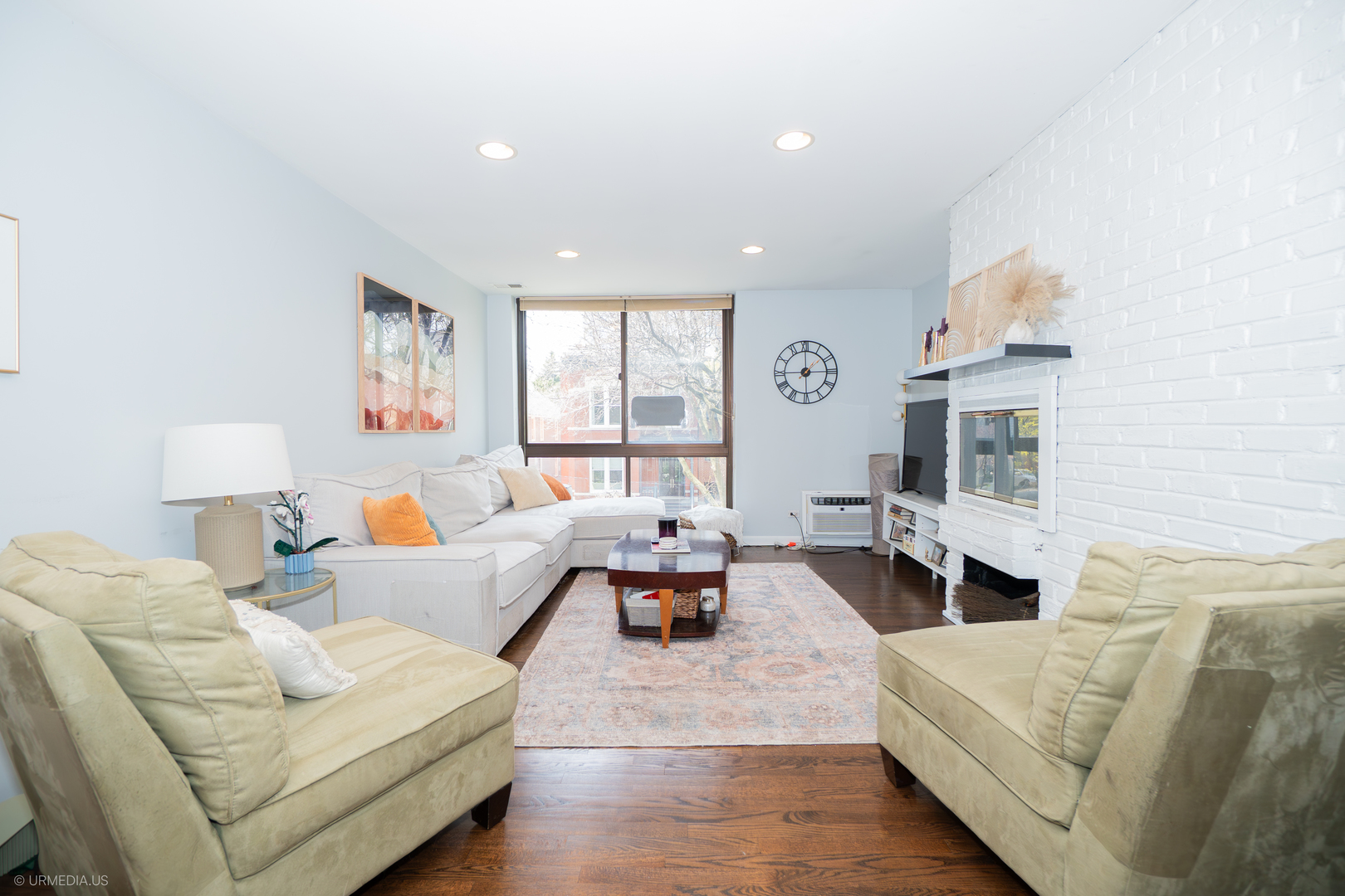 2201 North Cleveland Avenue, Unit 306 Chicago, IL 60614 - Photo 2 of 22 a living room with furniture and a fireplace