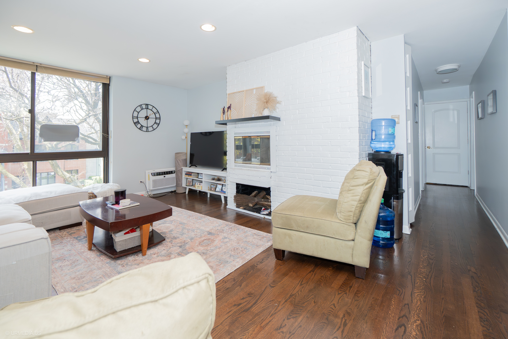 2201 North Cleveland Avenue, Unit 306 Chicago, IL 60614 - Photo 3 of 22 a living room with furniture large window and flat screen tv