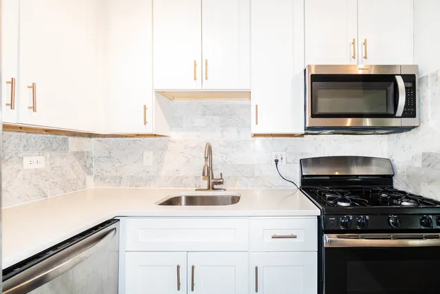 a kitchen with a stove and a microwave