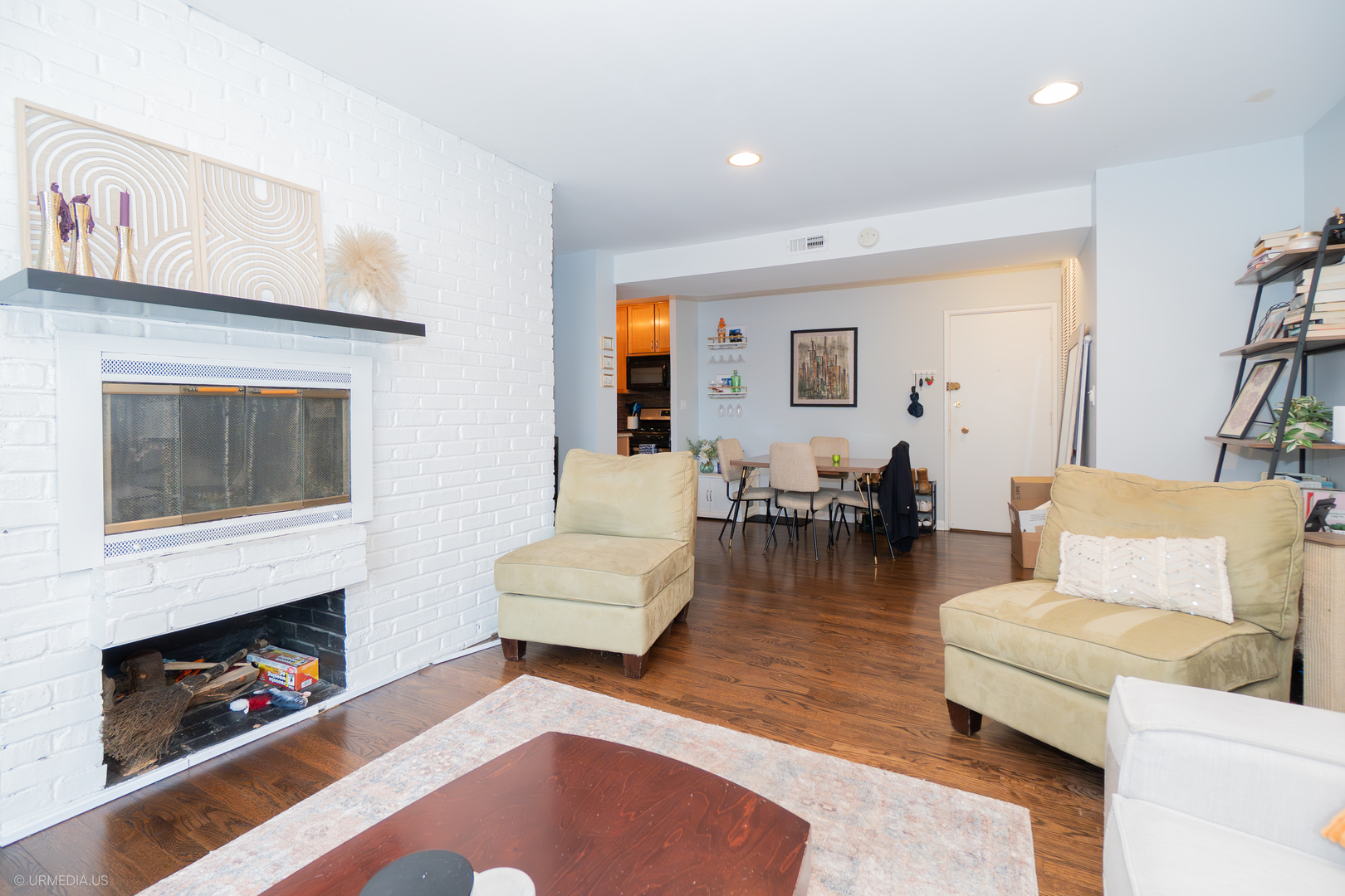2201 North Cleveland Avenue, Unit 306 Chicago, IL 60614 - Photo 9 of 22 a living room with fireplace furniture and a wooden floor