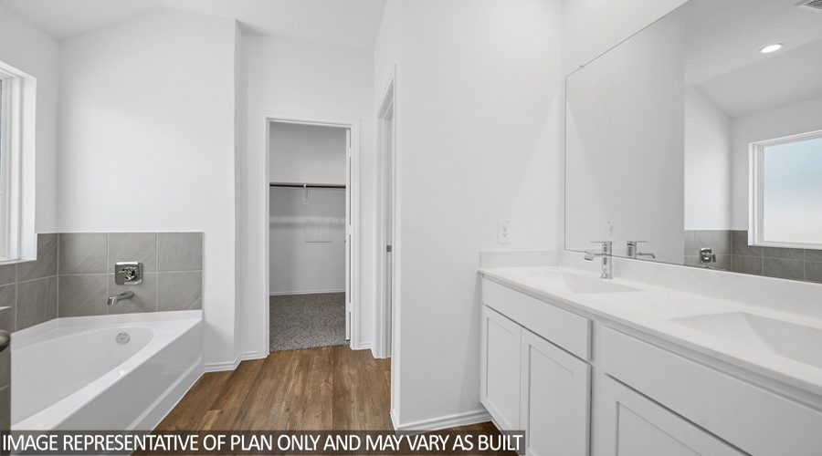 4323 Multnomah Falls Conroe, TX 77303 - Photo 11 of 25 a bathroom with a tub sink and mirror
