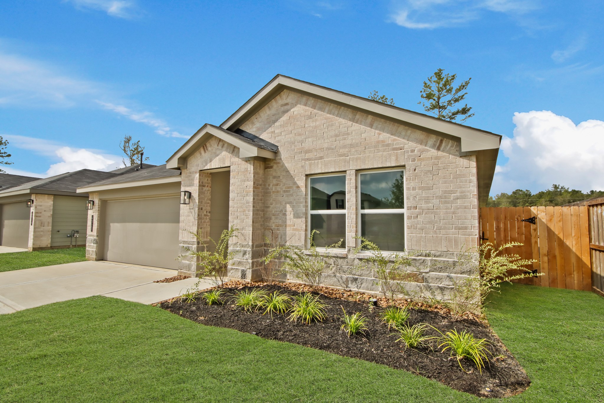 4323 Multnomah Falls Conroe, TX 77303 - Photo 2 of 25 a view of a house with a yard