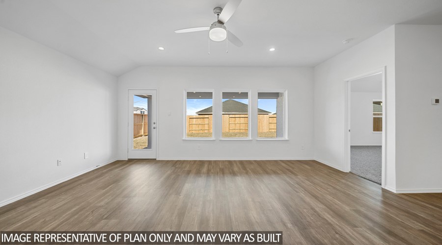 4323 Multnomah Falls Conroe, TX 77303 - Photo 6 of 25 an empty room with wooden floor and windows