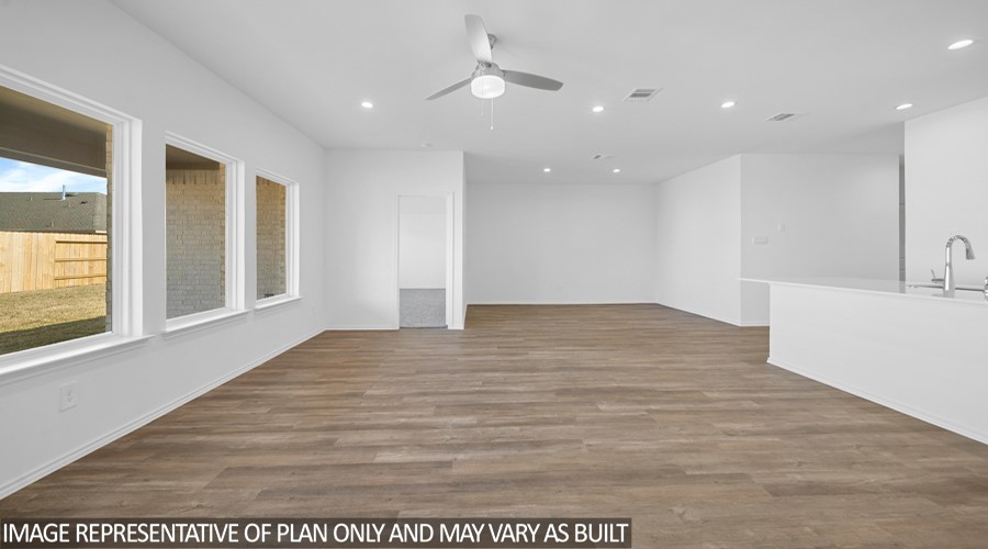 4323 Multnomah Falls Conroe, TX 77303 - Photo 7 of 25 a view of an empty room with wooden floor and a window