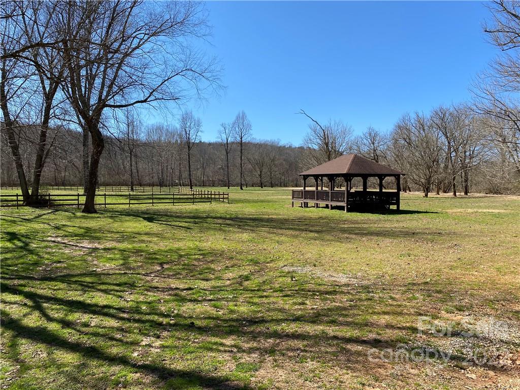 0 Rambling Creek Road, Unit 16 Tryon, NC 28782 - Photo 7 of 11 a view of a room with a big yard