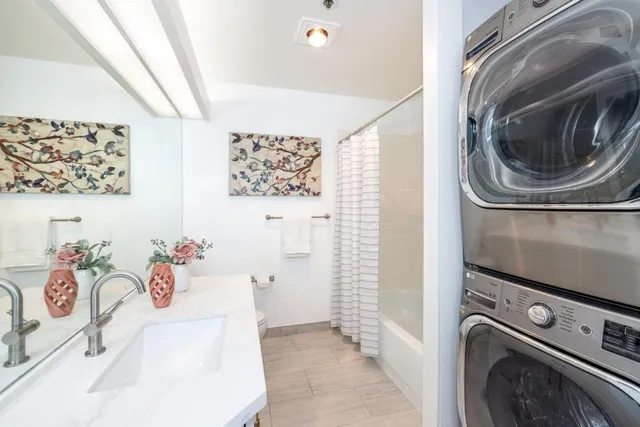 a utility room with a window dryer and washer