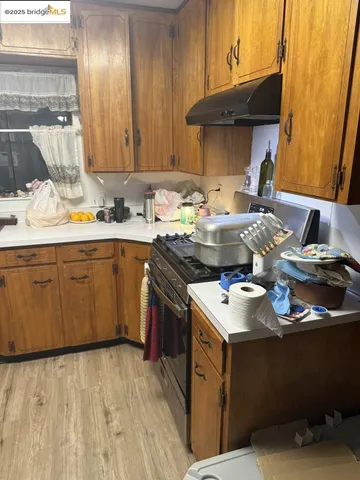 a kitchen with a sink cabinets and window