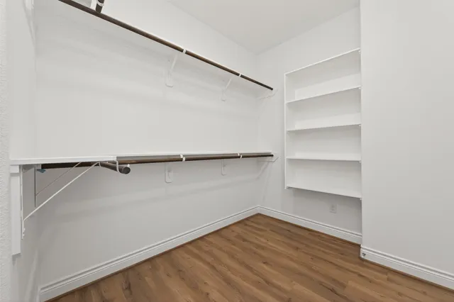 a view of a room with shelf on the wall