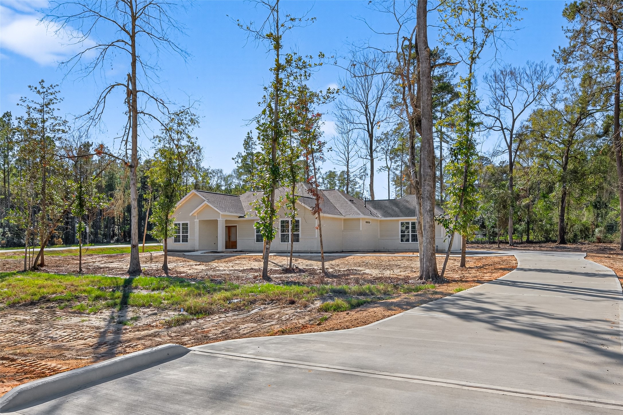 12879 Oak Barrel Road Willis, TX 77378 - Photo 2 of 37 a front view of a house with a yard