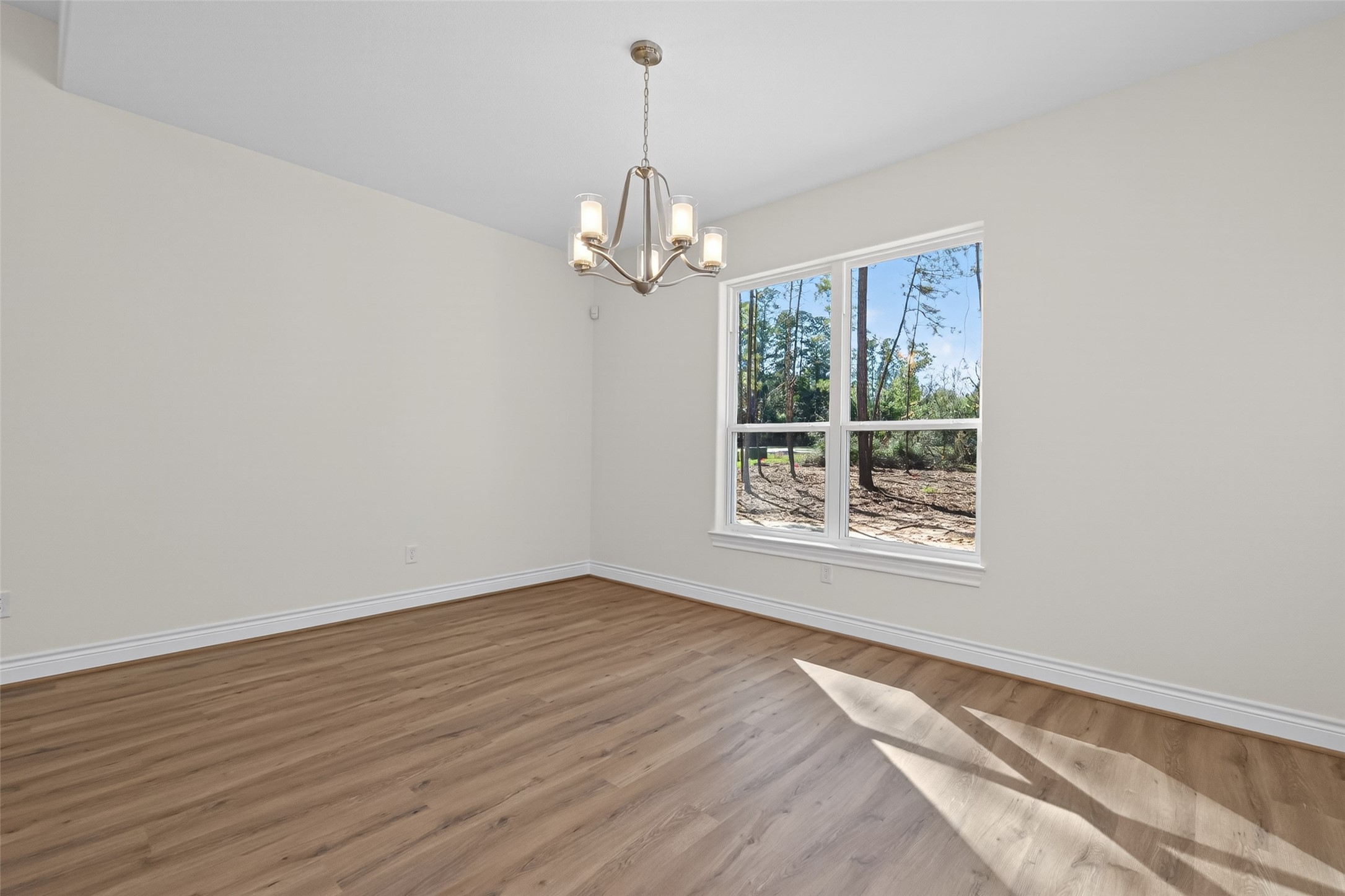 12879 Oak Barrel Road Willis, TX 77378 - Photo 21 of 37 a view of a windows and chandelier in a room