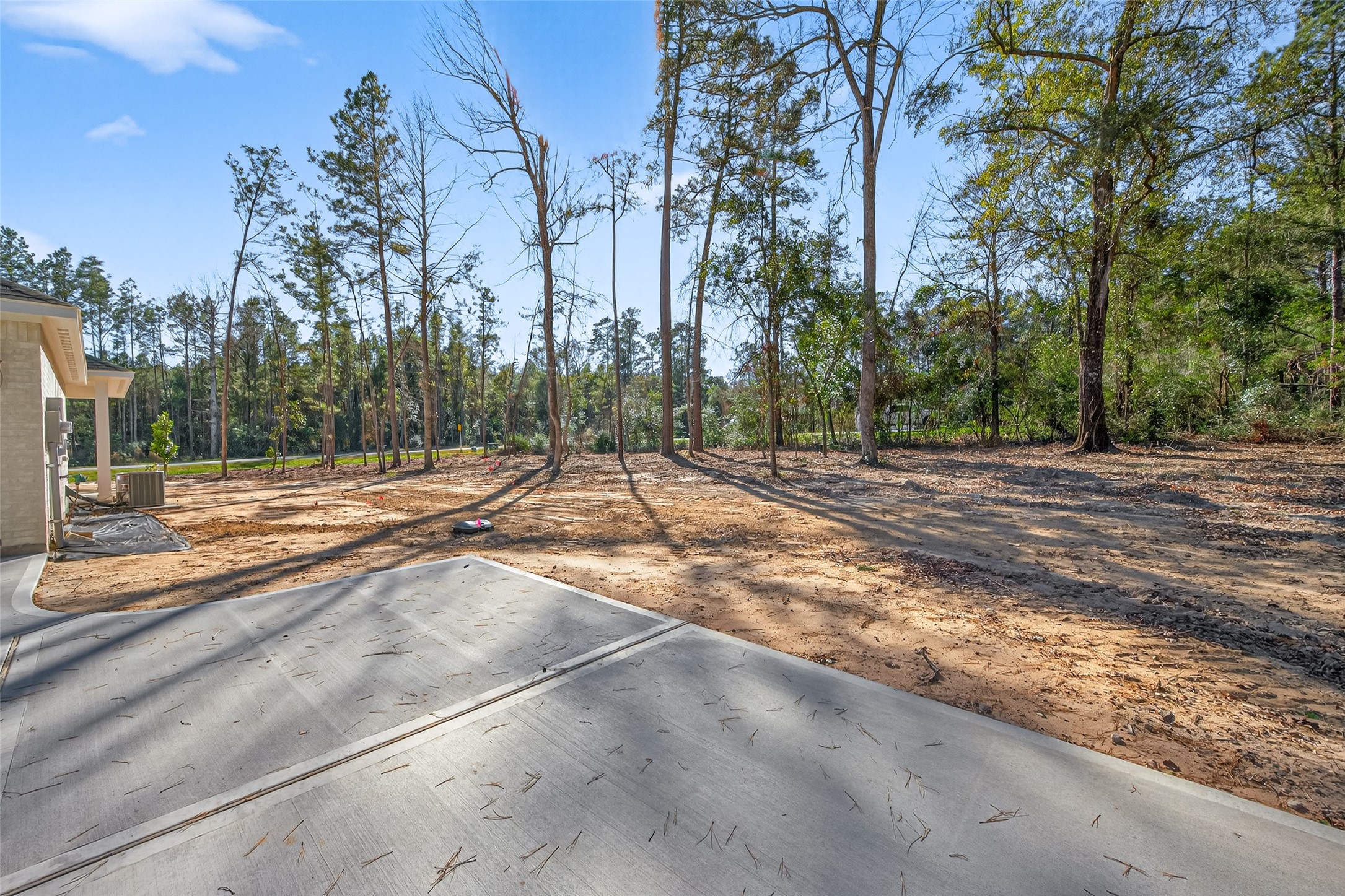 12879 Oak Barrel Road Willis, TX 77378 - Photo 30 of 37 a backyard of a house with lots of trees