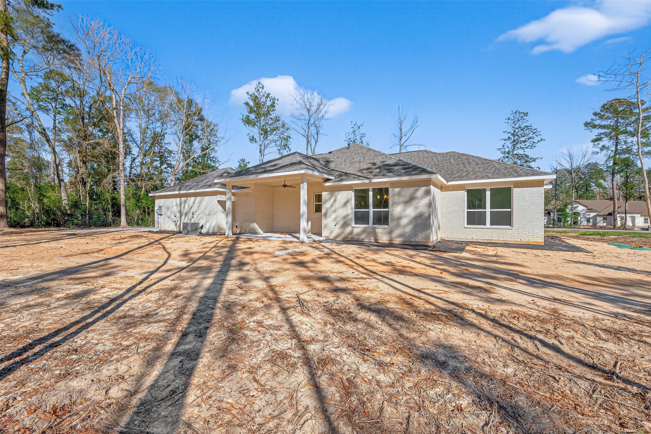 12879 Oak Barrel Road Willis, TX 77378 - Photo 31 of 37 a view of a house with a yard