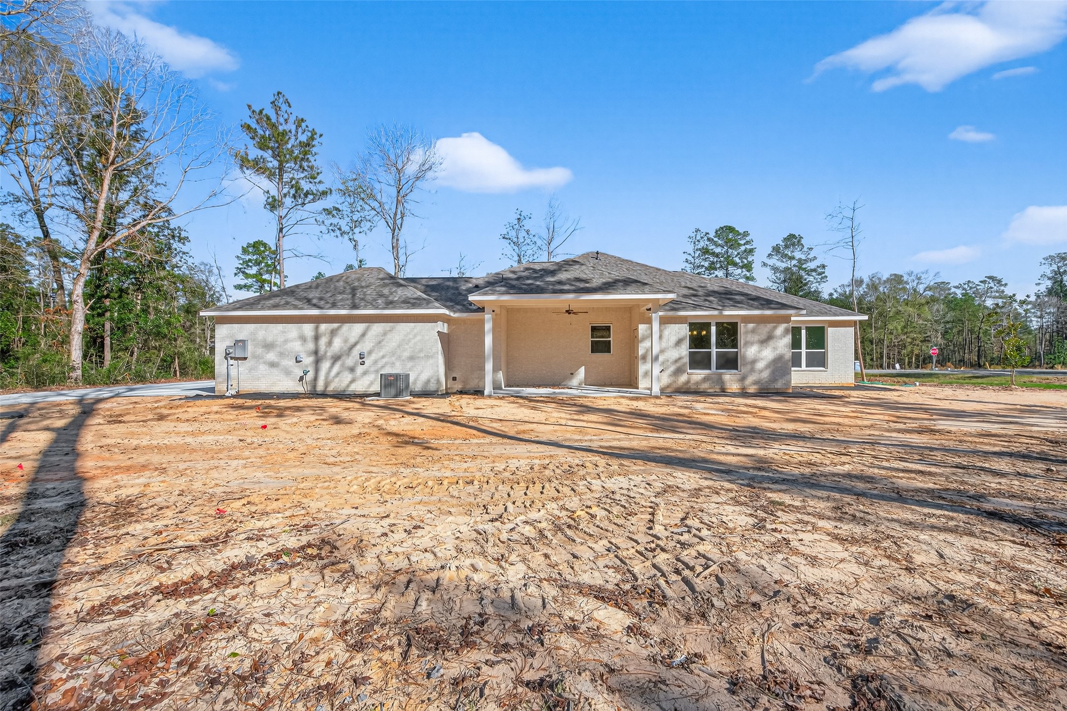 12879 Oak Barrel Road Willis, TX 77378 - Photo 32 of 37 a front view of a house with a garden