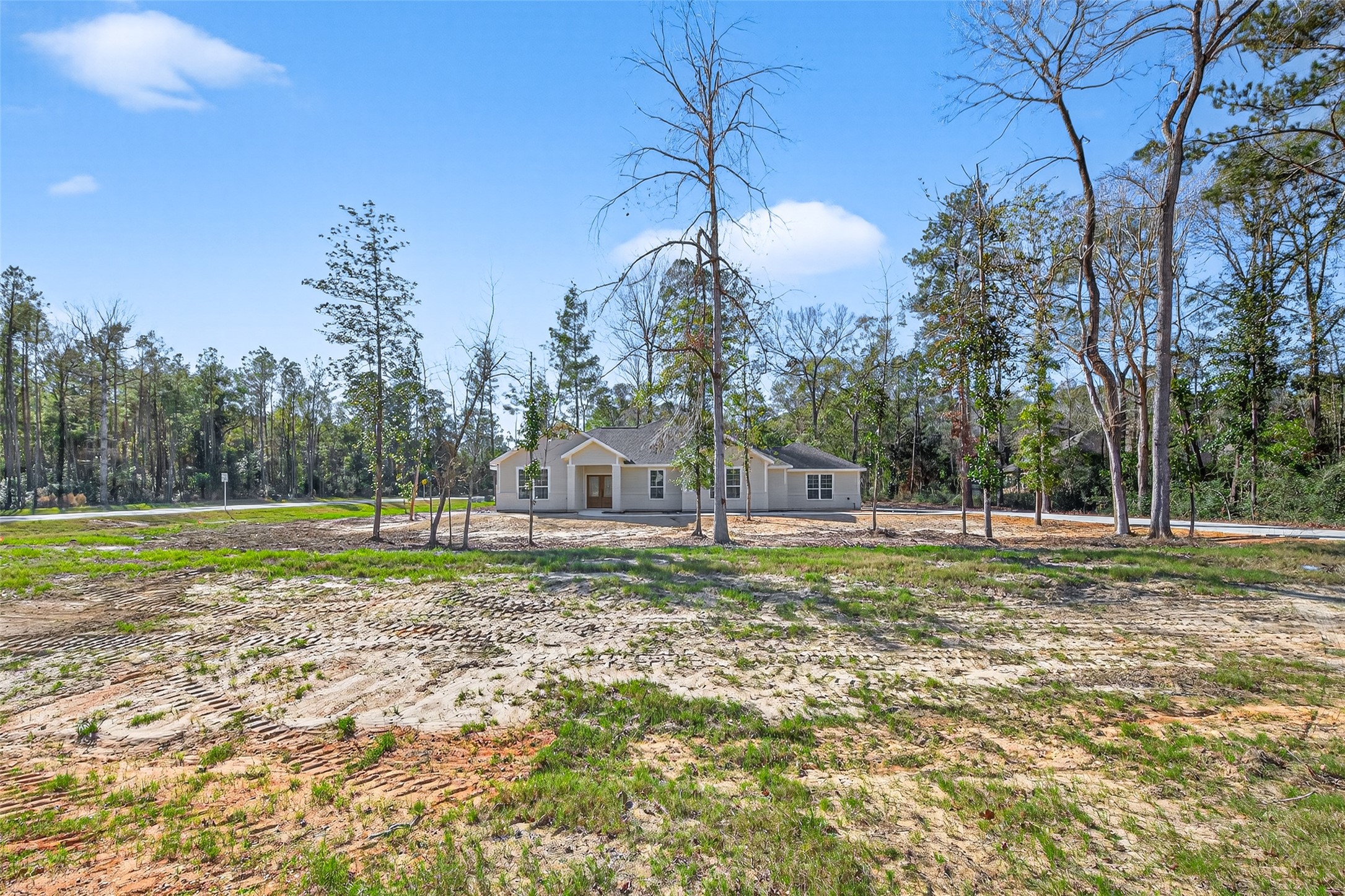12879 Oak Barrel Road Willis, TX 77378 - Photo 34 of 37 a view of a house with a yard