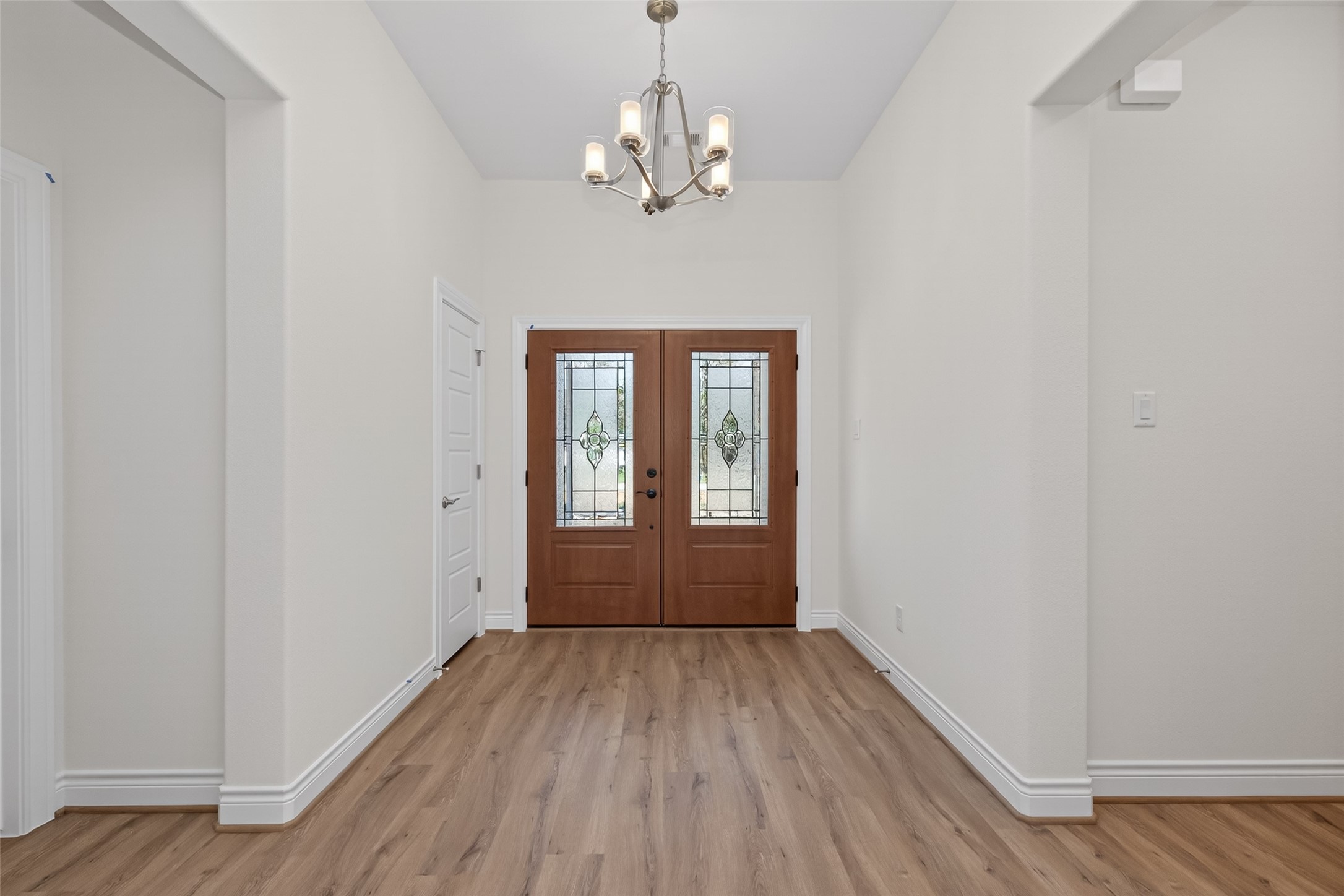 12879 Oak Barrel Road Willis, TX 77378 - Photo 5 of 37 wooden floor in an empty room with a window