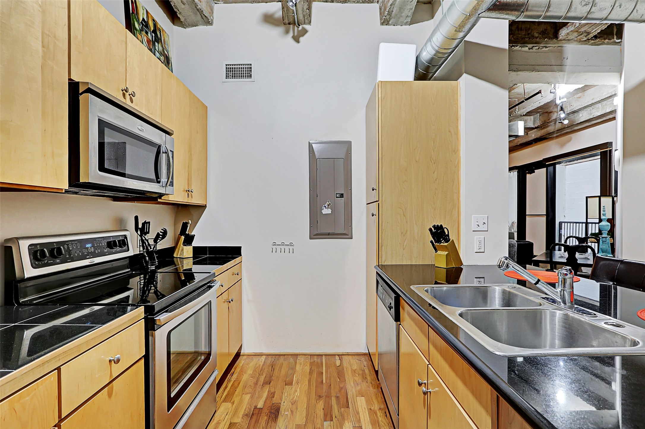 917 Main Street, Unit 503 Houston, TX 77002 - Photo 11 of 31 a kitchen with stainless steel appliances granite countertop a sink and a stove