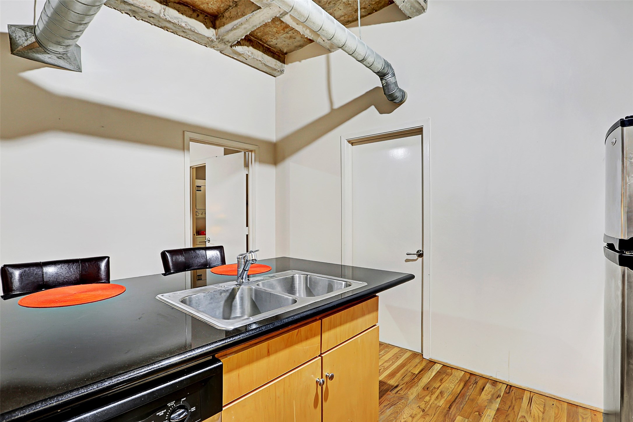 917 Main Street, Unit 503 Houston, TX 77002 - Photo 12 of 31 a kitchen with a sink and a stove top oven