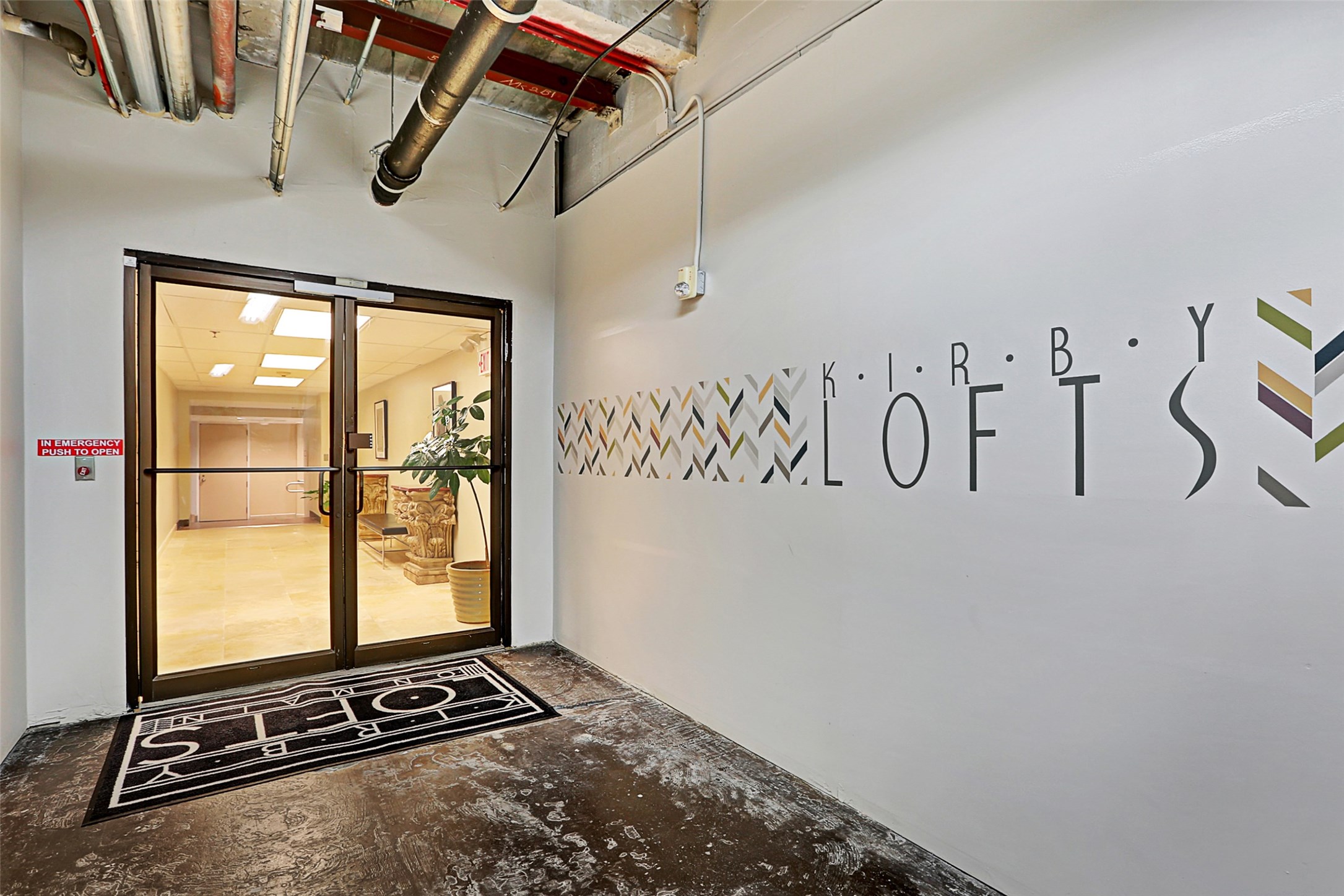 917 Main Street, Unit 503 Houston, TX 77002 - Photo 9 of 31 a view of a front door with wooden floor